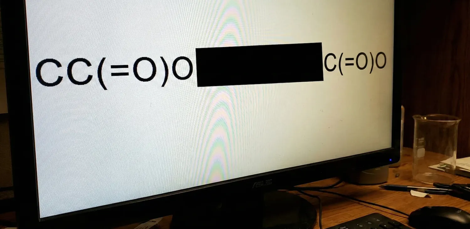 ChemBERTa masked language modeling visualization showing SMILES string CC(=O)O with masked tokens