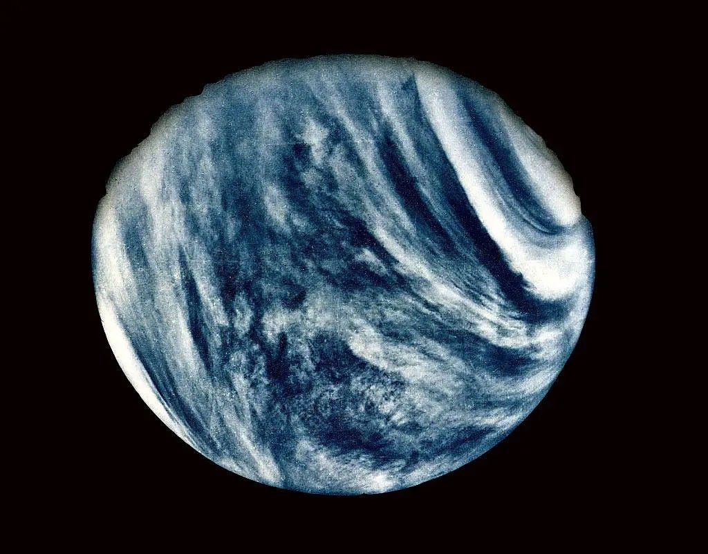 Venus as seen by Mariner 10, showing swirling cloud patterns in the dense atmosphere